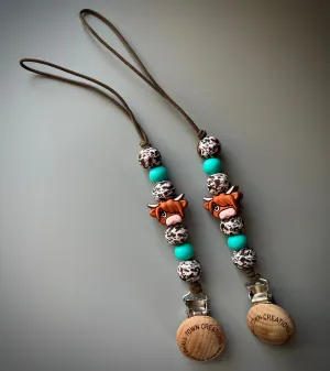 Brown Cow Print Turquoise Pacifier Holder